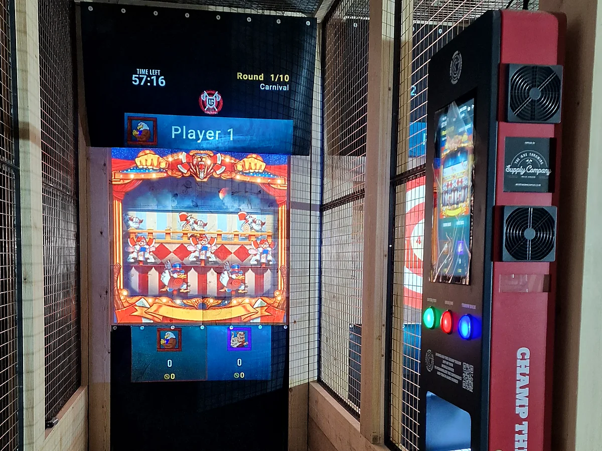 Projected carnival game and Champ Throw controller within an installed timber lane
