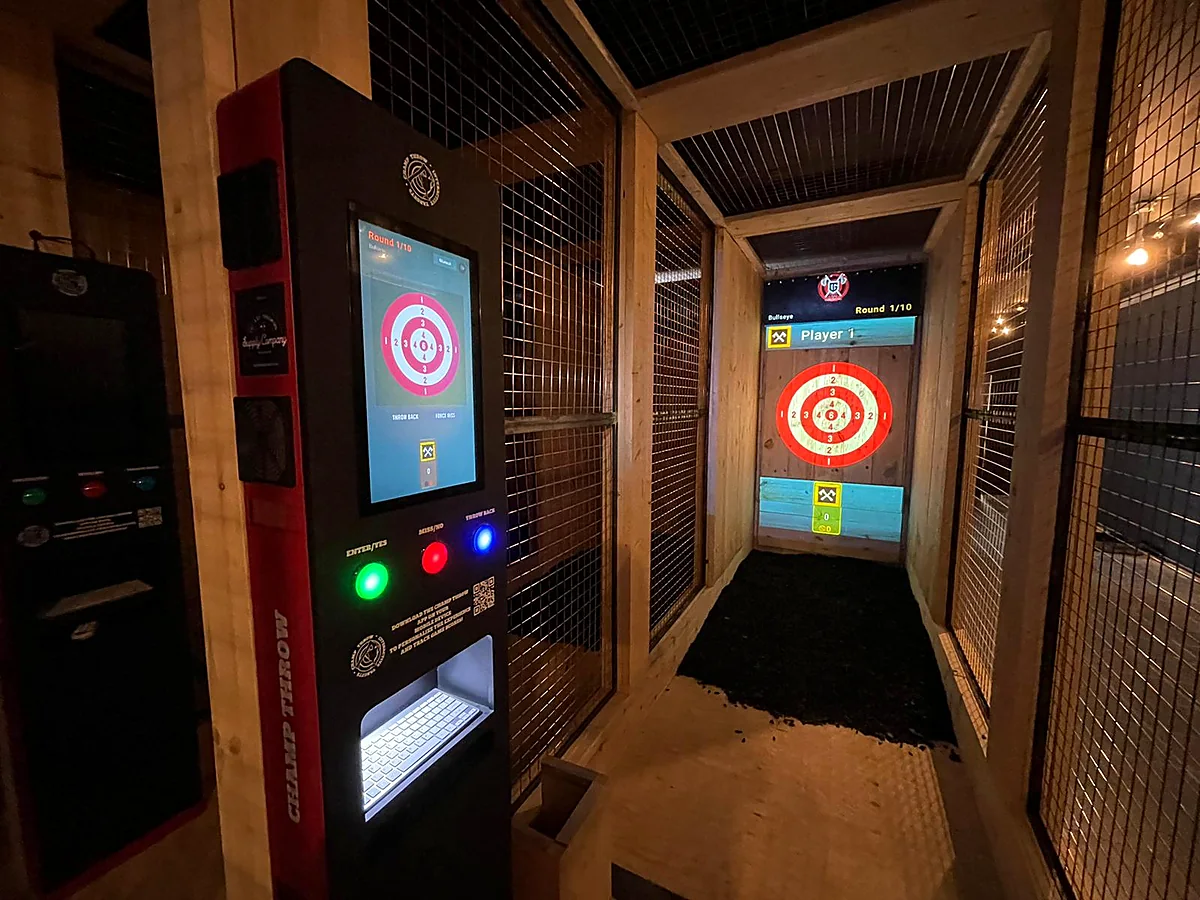 Champ Throw touchscreen controller beside a lane with projected target and scoring