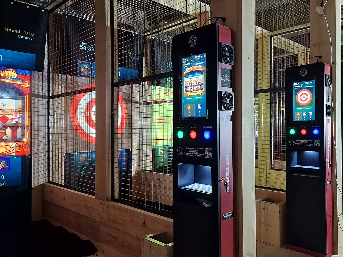 Bank of Champ Throw digital scoring cabinets and projected games installed across multiple timber lanes