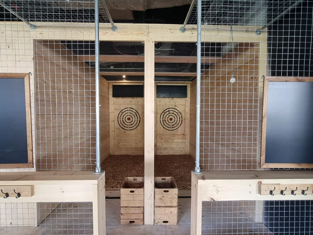 Front view of a twin commercial axe throwing lane installation with two timber targets