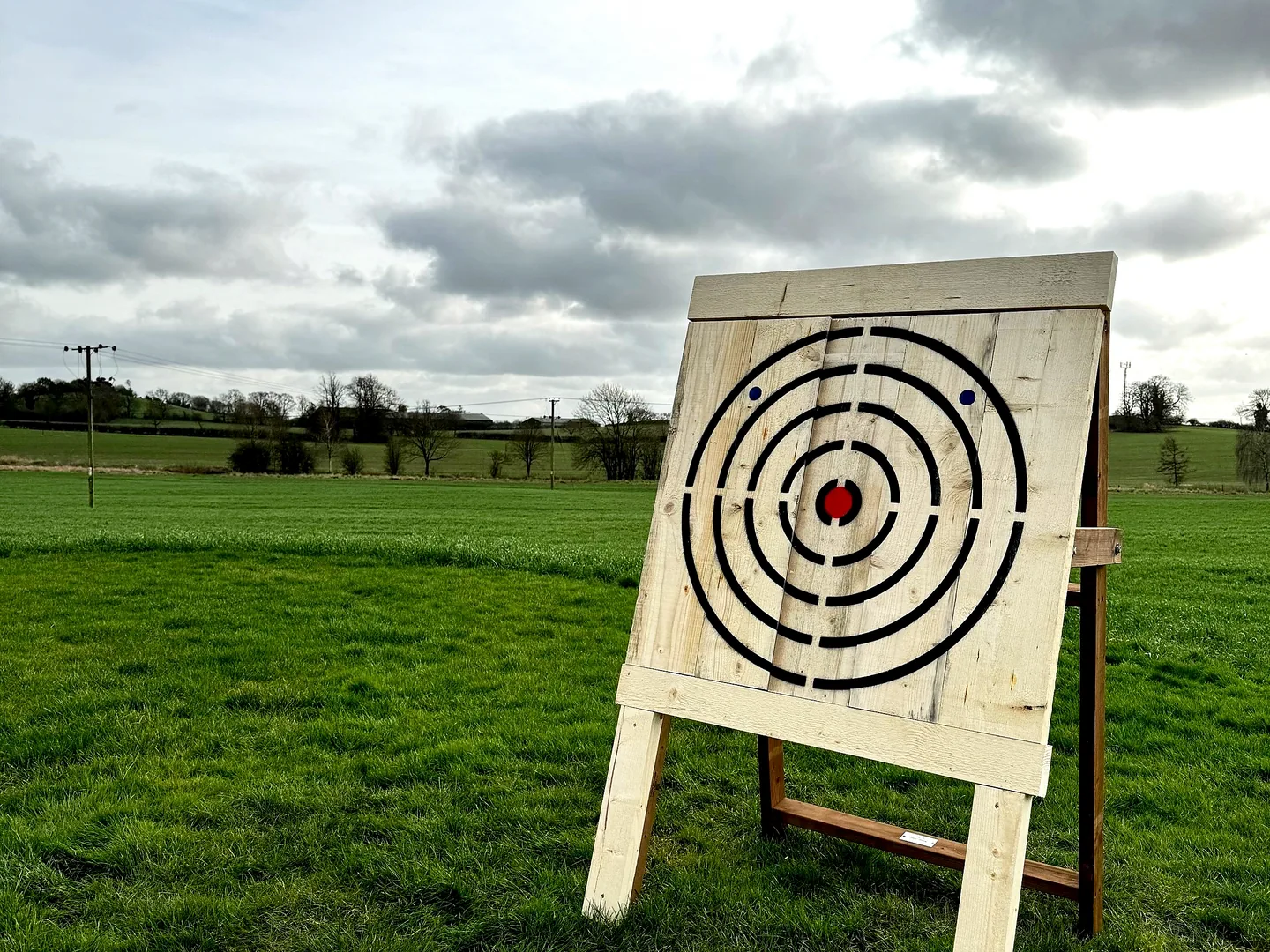 Commercial grade portable folding target holder with target fitted