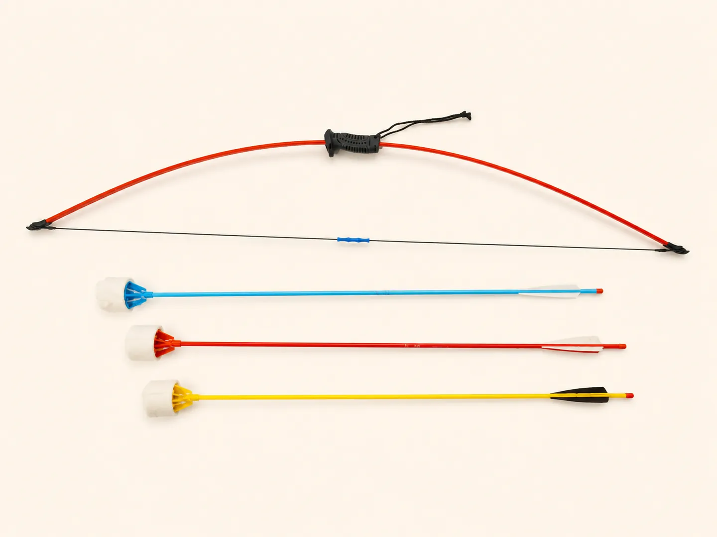 Champ Throw Velcro Archery Kit with one red bow and three arrows on ivory